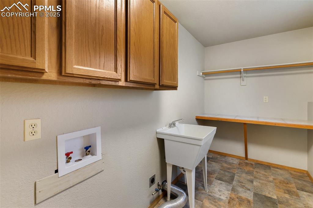 1380 Rampart Range Road Woodland Park, CO 80863 - Photo 21 of 30 a room with storage and utility