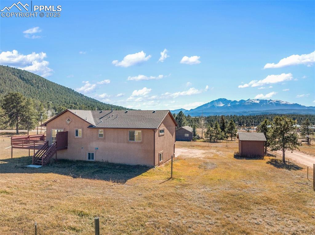 1380 Rampart Range Road Woodland Park, CO 80863 - Photo 29 of 30 a view of a terrace with a table and chairs