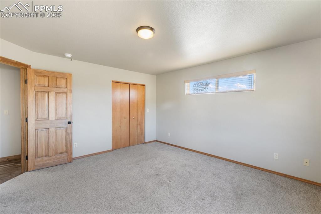 1380 Rampart Range Road Woodland Park, CO 80863 - Photo 9 of 30 a view of an empty room