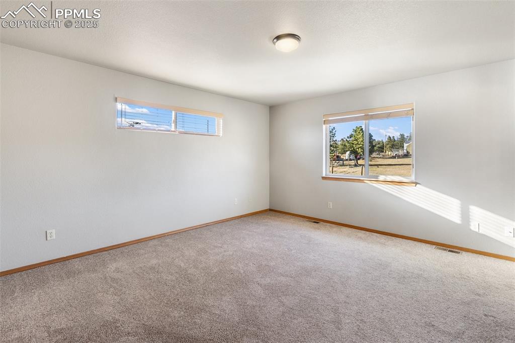 1380 Rampart Range Road Woodland Park, CO 80863 - Photo 10 of 30 an empty room with windows