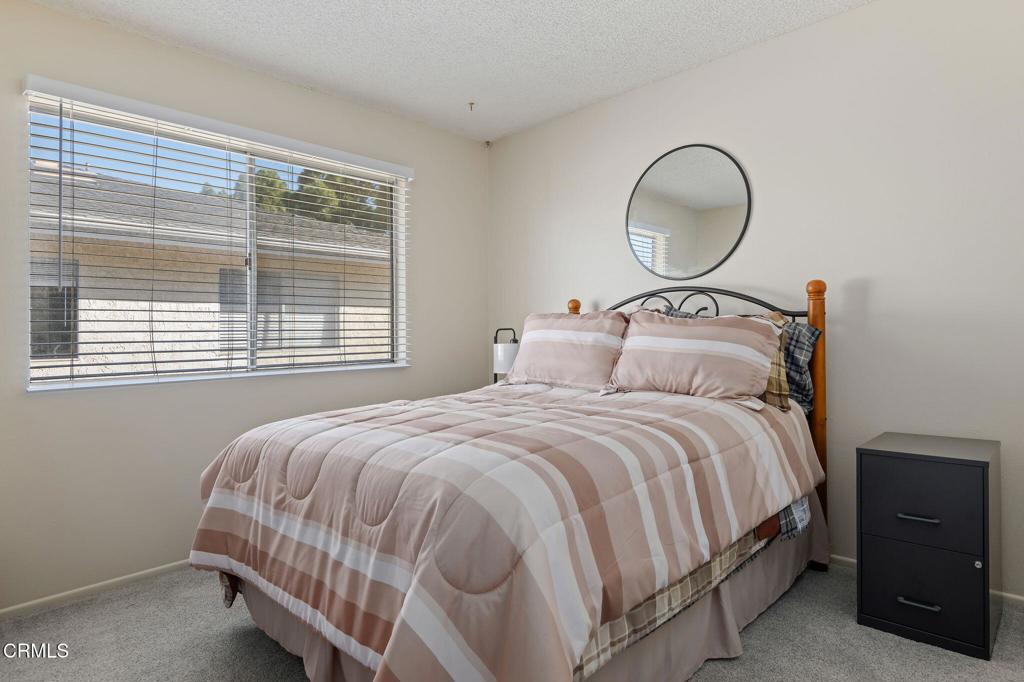 2606 Rudder Avenue Port Hueneme, CA 93041 - Photo 12 of 16 a bedroom with a bed lamp and window