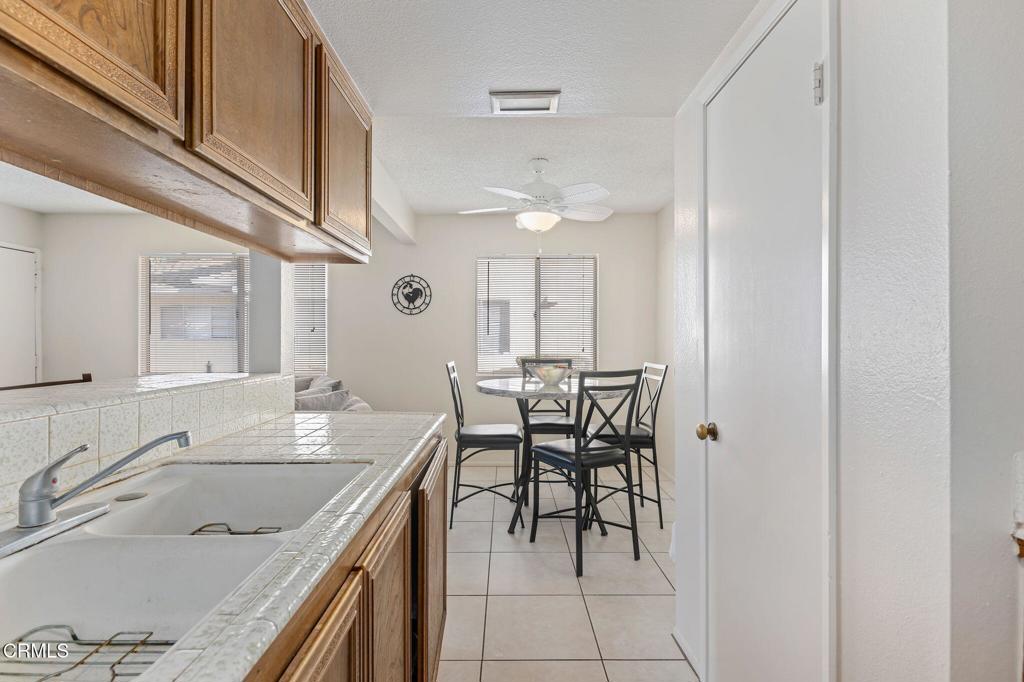 2606 Rudder Avenue Port Hueneme, CA 93041 - Photo 8 of 16 a kitchen with a sink a table and chairs