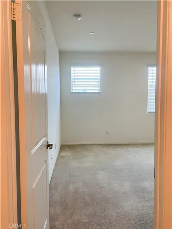 a spacious bathroom with a double vanity sink and a mirror