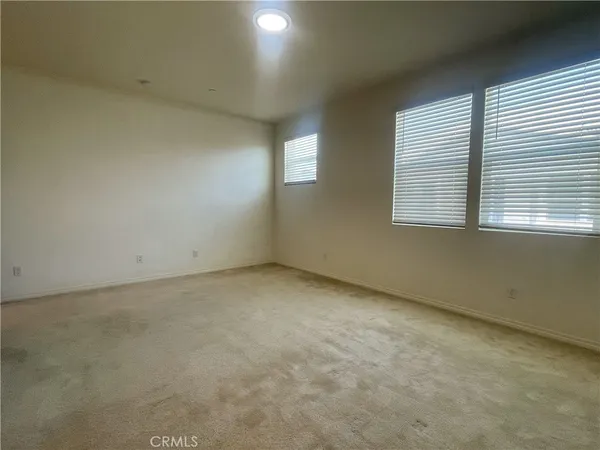 a bathroom with double sink and a mirror