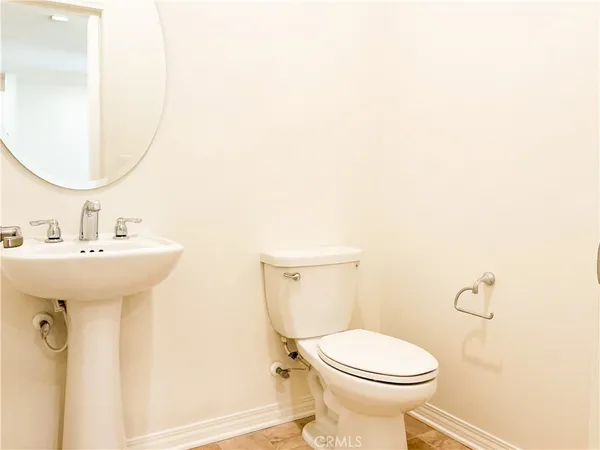 a kitchen with stainless steel appliances granite countertop a refrigerator a stove a sink and a microwave