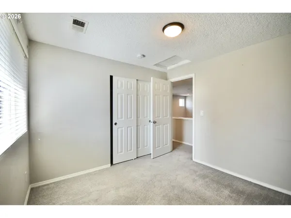 a bathroom with a granite countertop sink