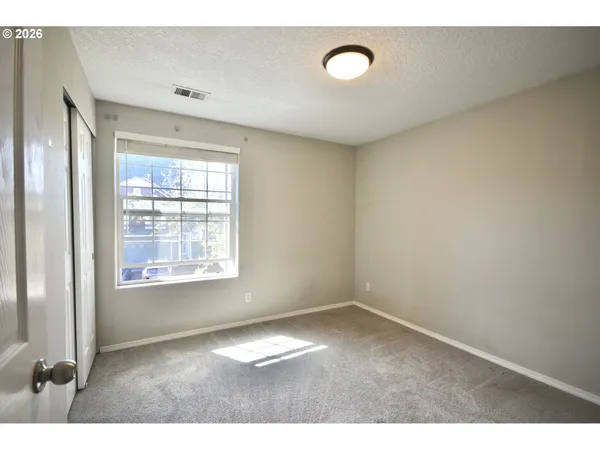 a bathroom with a double vanity sink mirror and shower