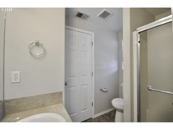 a view of an empty room and a window