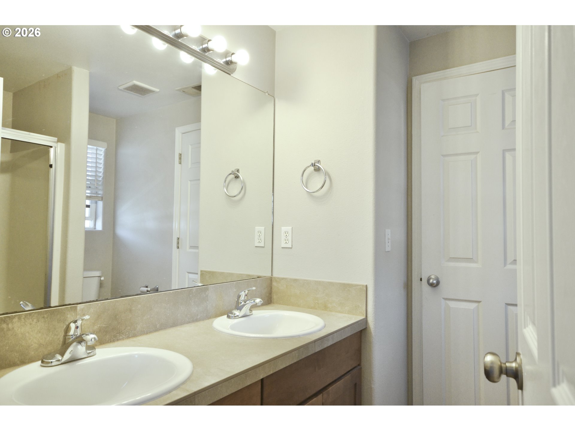 20583 Southwest Tesoro Court Beaverton, OR 97003 - Photo 14 of 28 a bathroom with a double vanity sink mirror and shower