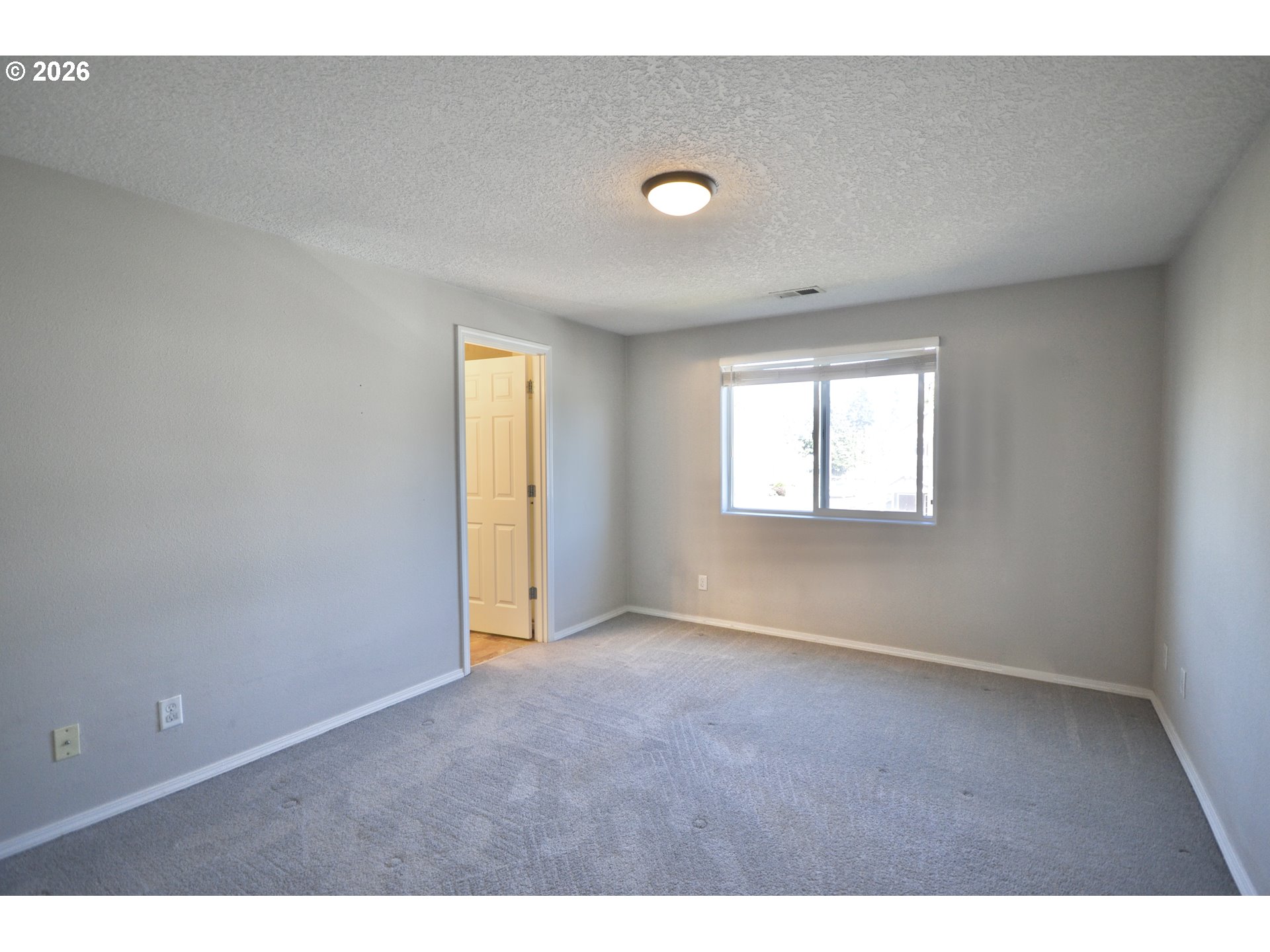 20583 Southwest Tesoro Court Beaverton, OR 97003 - Photo 18 of 28 a view of an empty room with a window
