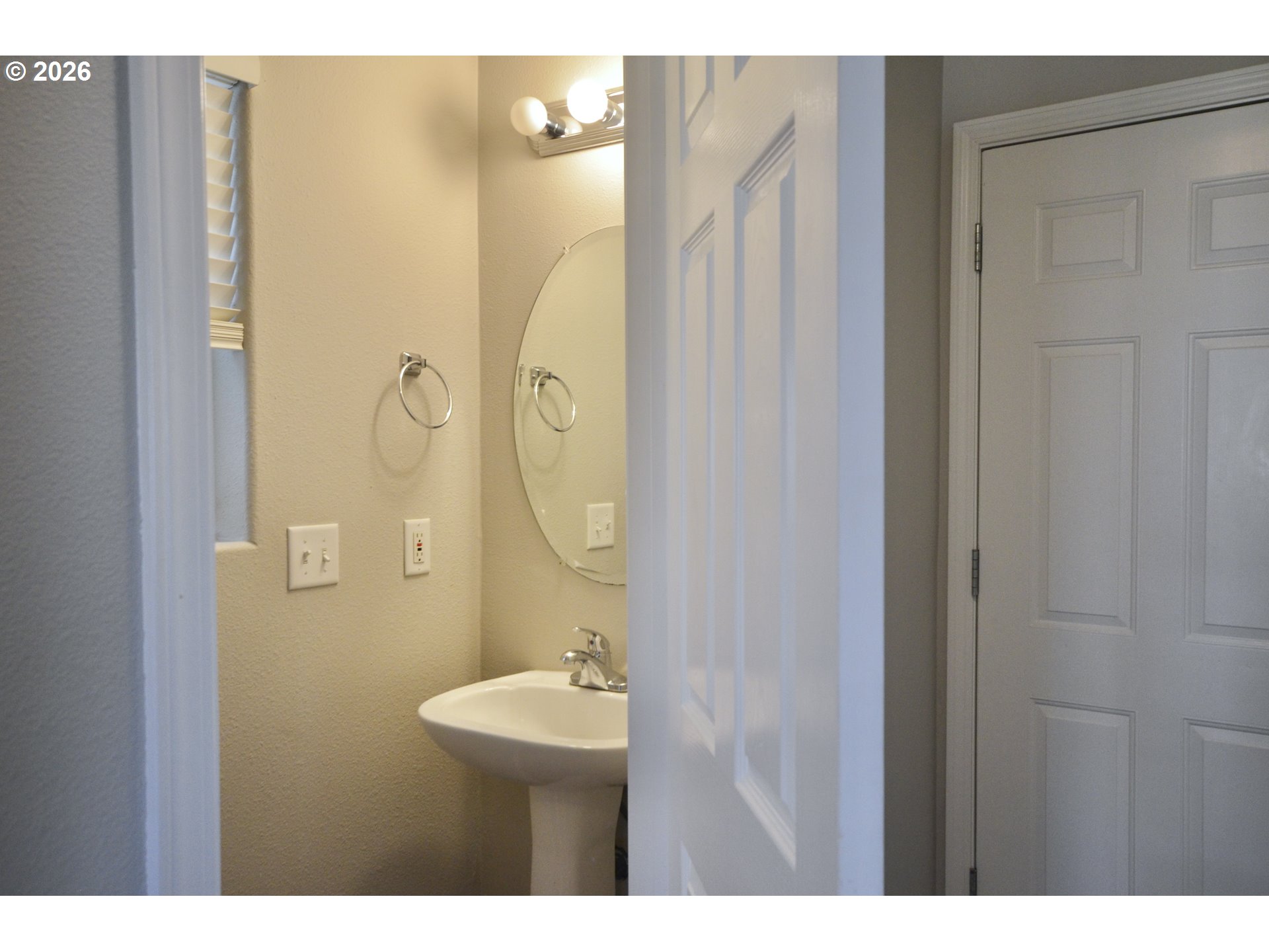20583 Southwest Tesoro Court Beaverton, OR 97003 - Photo 20 of 28 a bathroom with a sink mirror and toilet