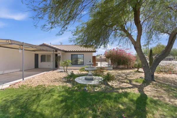 a house that has tree in front of it