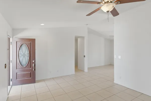 a view of a livingroom with a chandelier fan and furniture