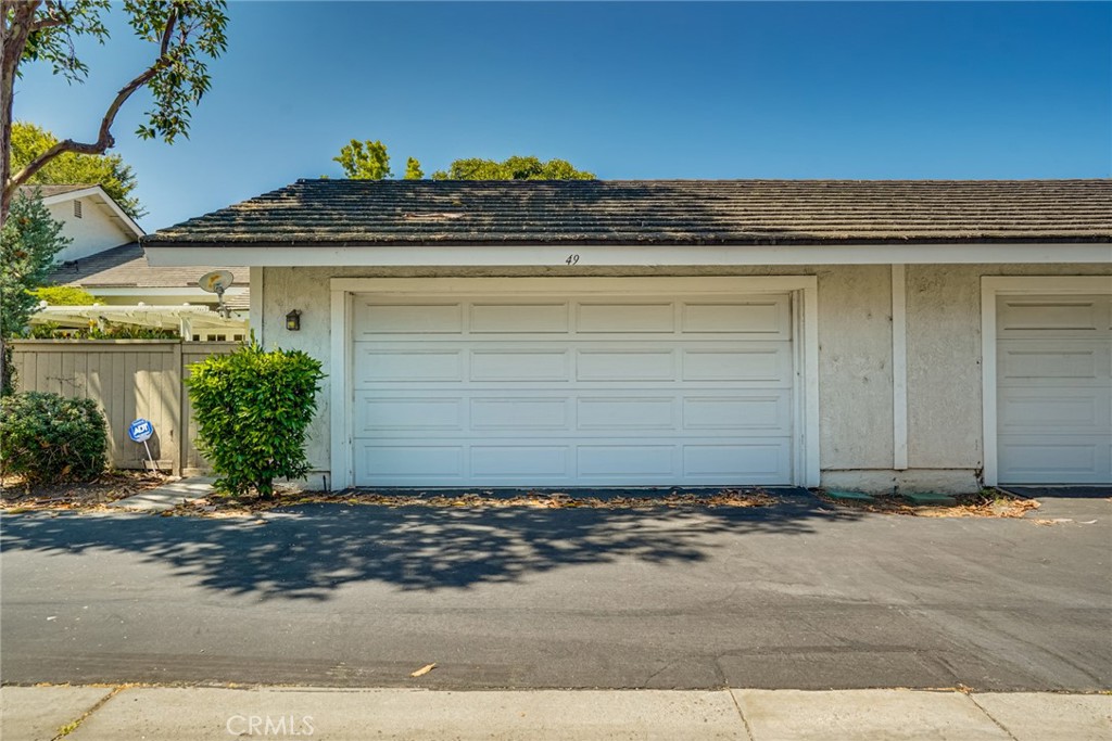 49 East Yale Loop, Unit 26 Irvine, CA 92604 - Photo 53 of 63 a view of a house with a yard