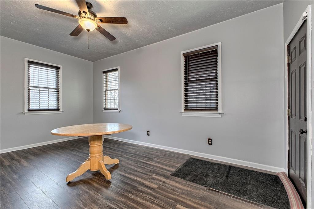 19 Lilly Lane Manor, PA 15665 - Photo 11 of 43 a view of a room with wooden floor gym equipment and windows