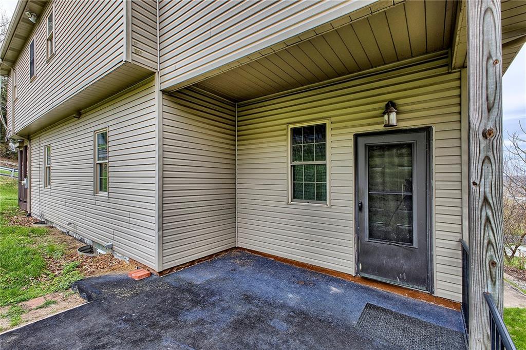 19 Lilly Lane Manor, PA 15665 - Photo 13 of 43 a view of a small house with wooden walls