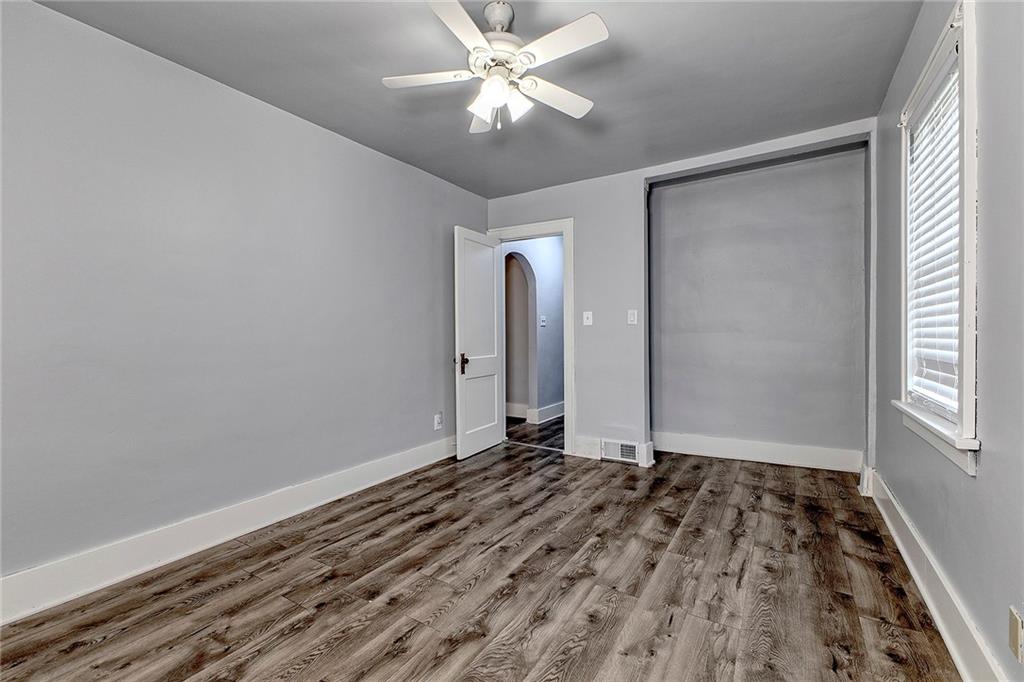 19 Lilly Lane Manor, PA 15665 - Photo 15 of 43 a view of an empty room with window and a chandelier fan