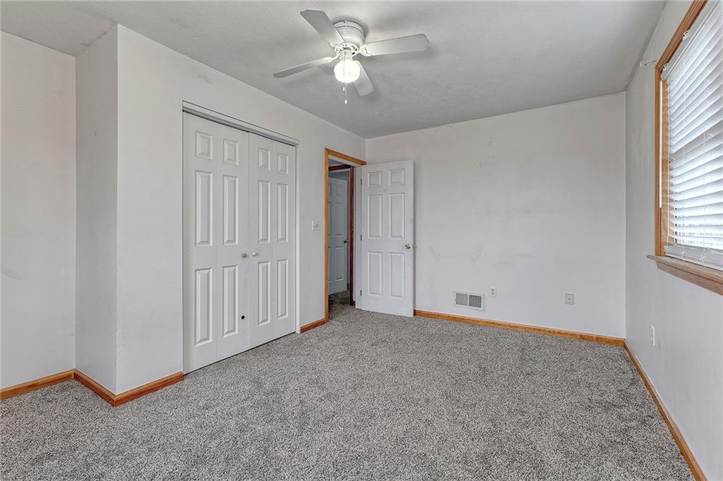 19 Lilly Lane Manor, PA 15665 - Photo 30 of 43 an empty room with chandelier fan and windows