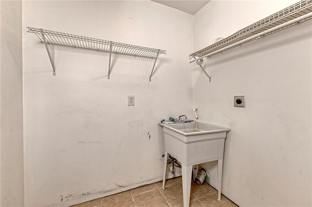 19 Lilly Lane Manor, PA 15665 - Photo 33 of 43 a bathroom with a sink a mirror and a shower curtain