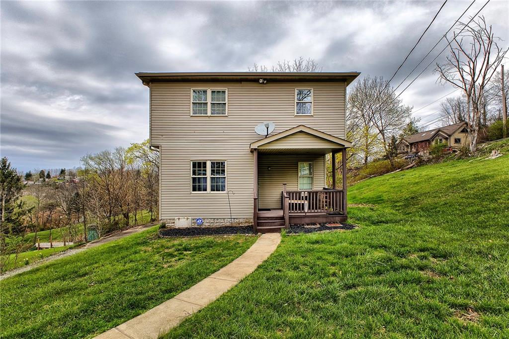 19 Lilly Lane Manor, PA 15665 - Photo 34 of 43 a front view of a house with garden