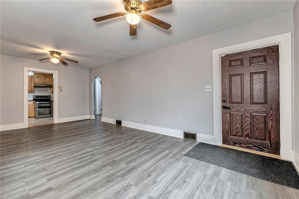 19 Lilly Lane Manor, PA 15665 - Photo 5 of 43 wooden floor in an empty room with a window
