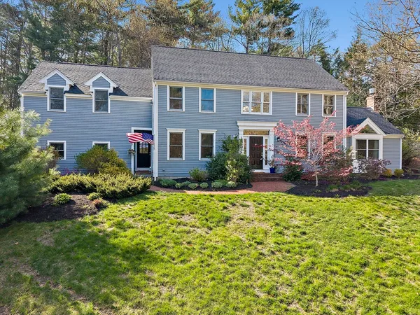 front view of a house with a yard