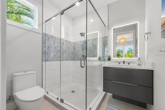 a bedroom with a bed wooden floor and window