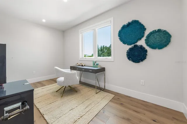 a spacious bedroom with a bed and a table