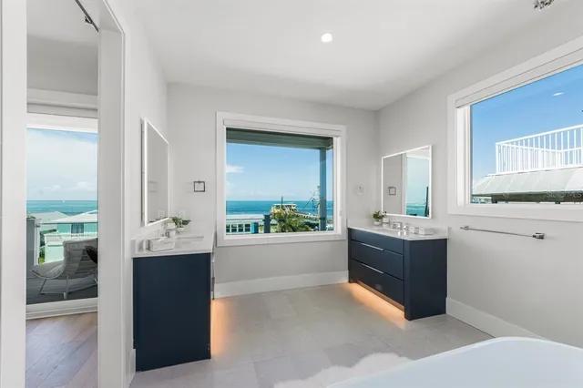 a spacious bathroom with a toilet sink and mirror