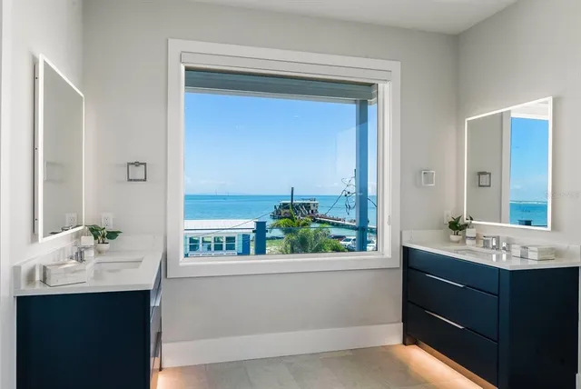 a roof deck with table and chairs a barbeque