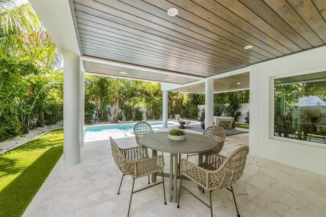 a view of a backyard with a patio