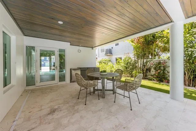 a view of a swimming pool with chairs