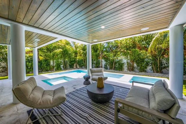 an aerial view of a house with a lake view