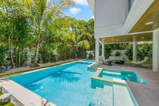 an aerial view of residential houses with city view