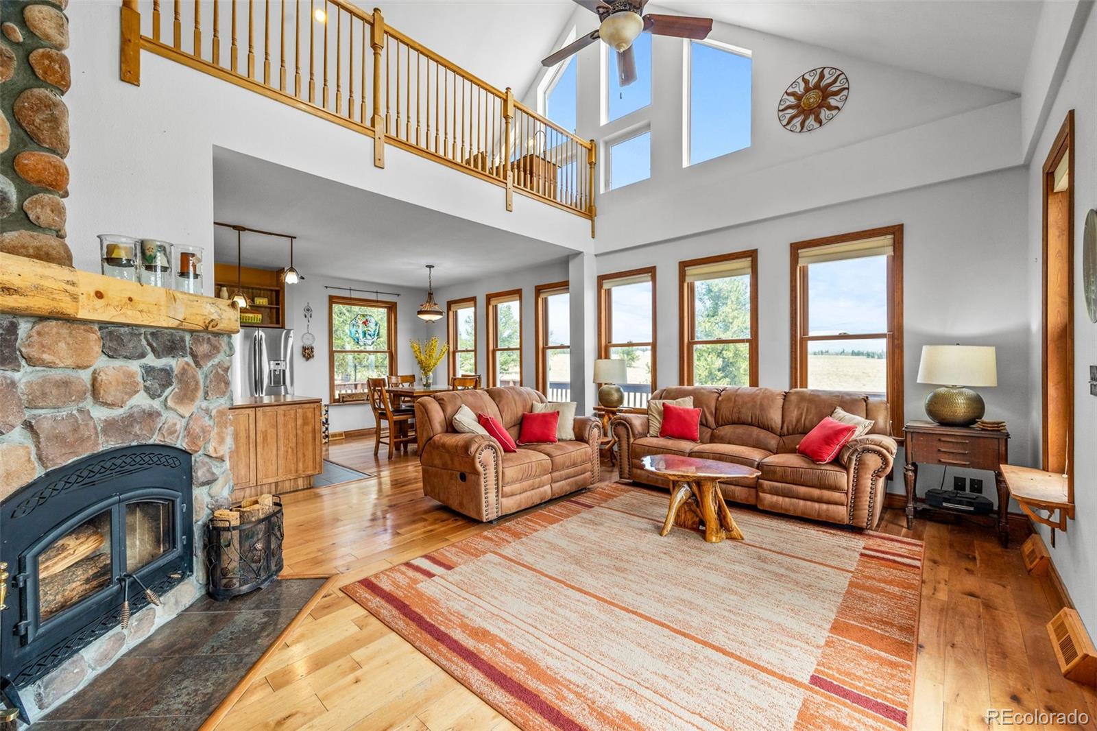 2020 Mullenville Road Fairplay, CO 80440 - Photo 12 of 49 a living room with furniture a rug and a fireplace