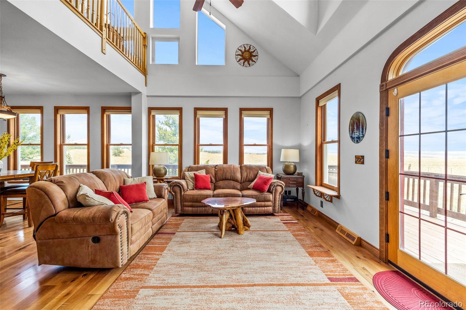 2020 Mullenville Road Fairplay, CO 80440 - Photo 13 of 49 a living room filled with furniture and floor to ceiling windows