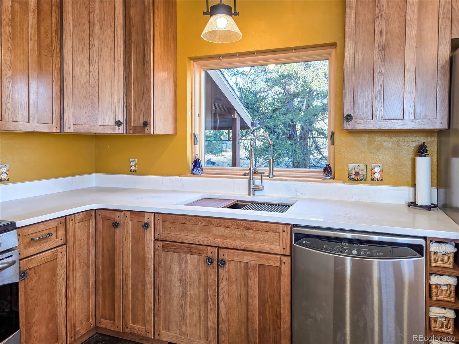 2020 Mullenville Road Fairplay, CO 80440 - Photo 16 of 49 a kitchen with a sink cabinets and outdoor space