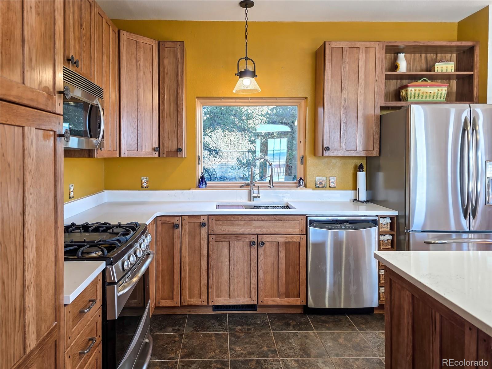 2020 Mullenville Road Fairplay, CO 80440 - Photo 18 of 49 a kitchen with stainless steel appliances granite countertop a sink stove and refrigerator