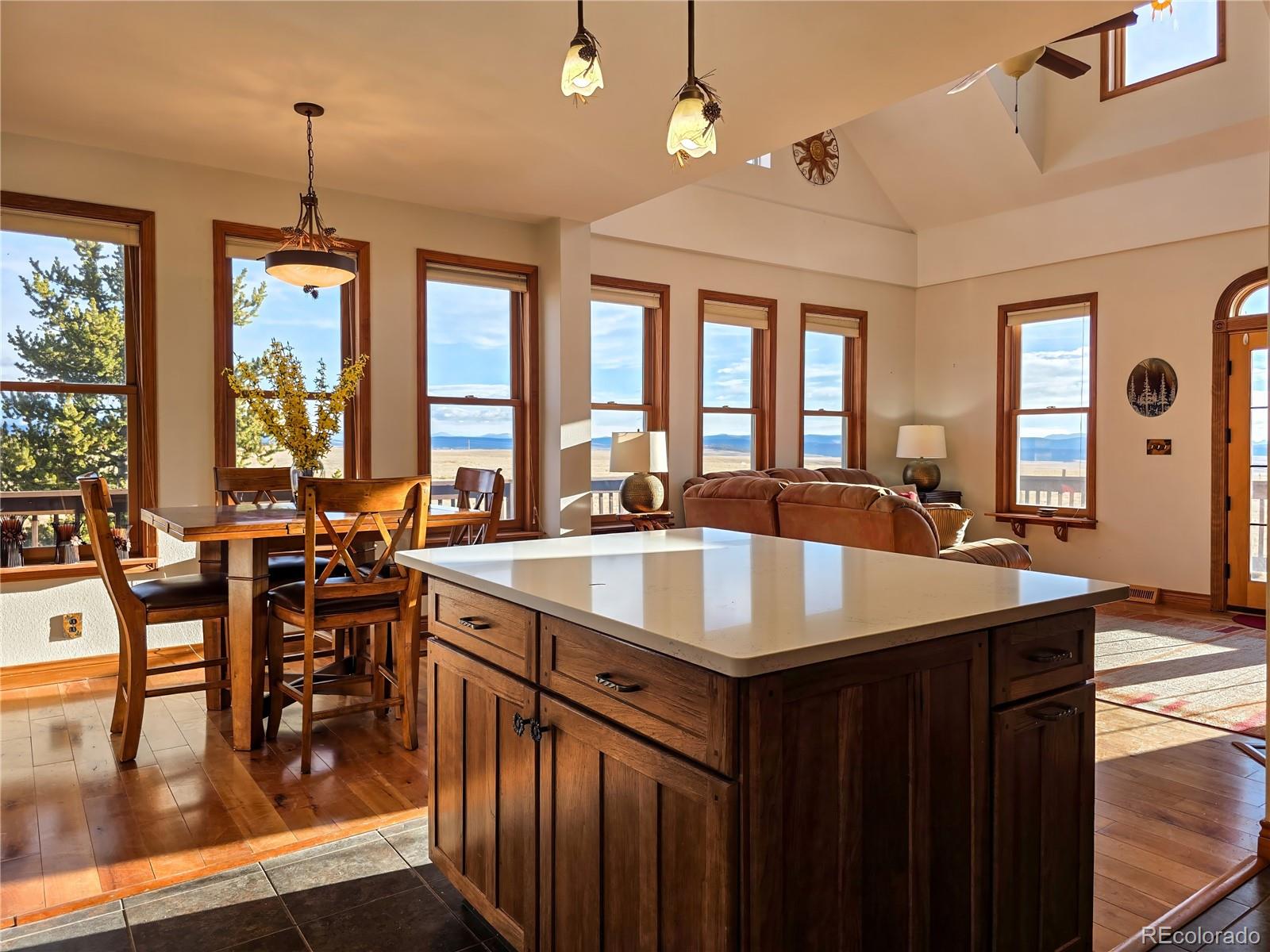 2020 Mullenville Road Fairplay, CO 80440 - Photo 21 of 49 a kitchen with a table chairs stove and cabinets