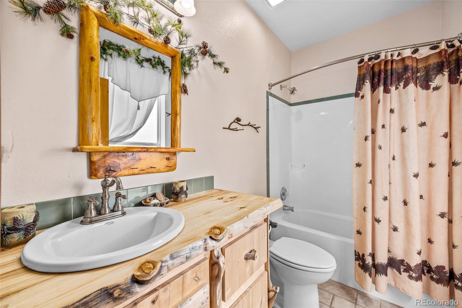 2020 Mullenville Road Fairplay, CO 80440 - Photo 25 of 49 a bathroom with a sink and a mirror