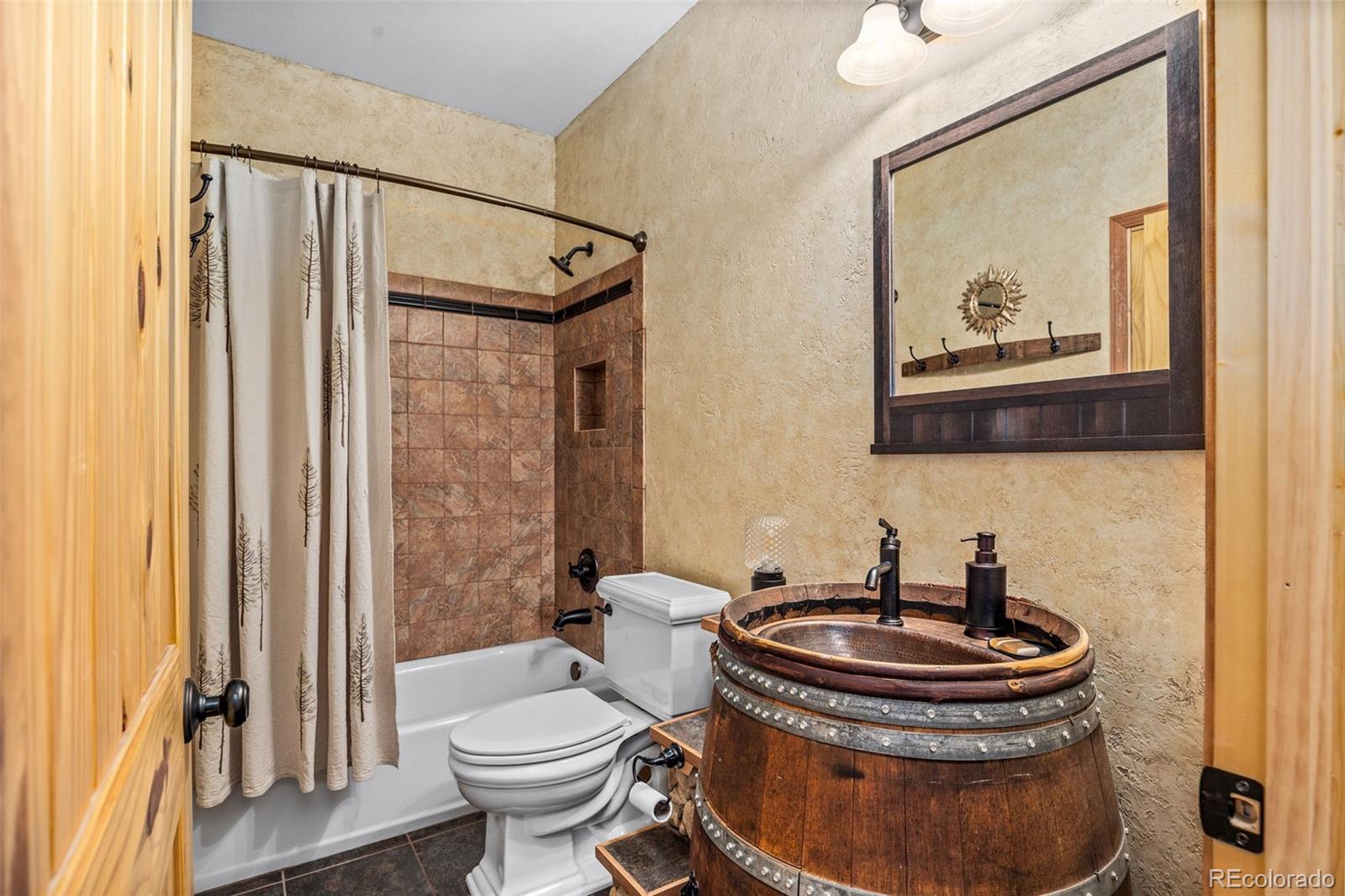 2020 Mullenville Road Fairplay, CO 80440 - Photo 27 of 49 a bathroom with a toilet sink and mirror