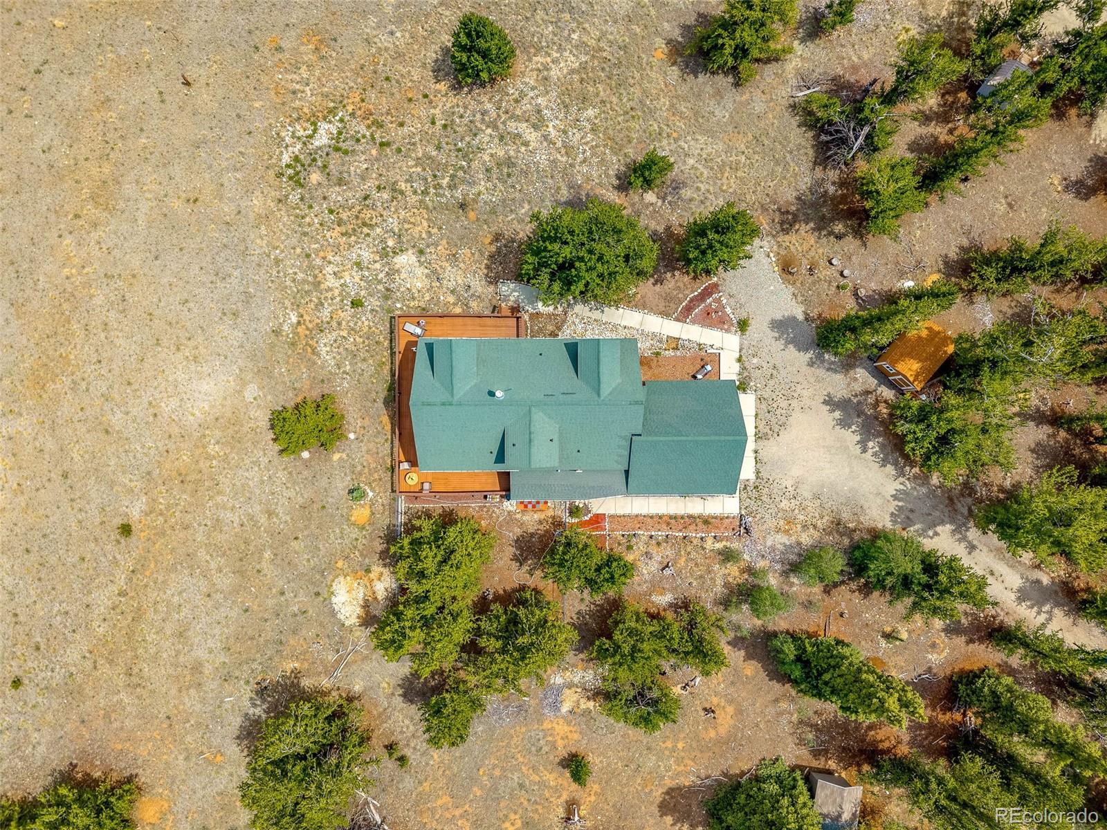 2020 Mullenville Road Fairplay, CO 80440 - Photo 46 of 49 an aerial view of a house with a yard and trees