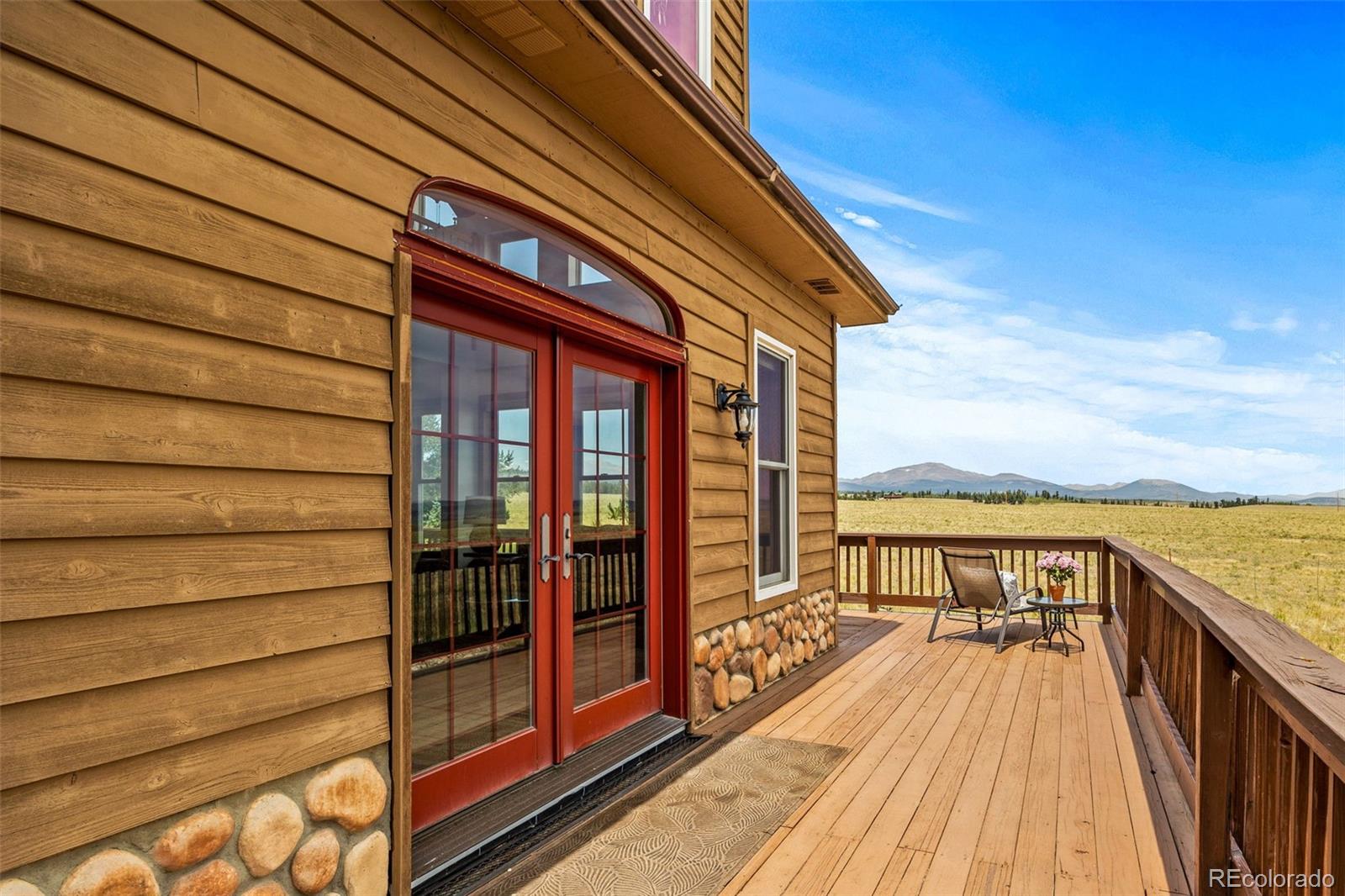 2020 Mullenville Road Fairplay, CO 80440 - Photo 10 of 49 a view of balcony with wooden floor and fence