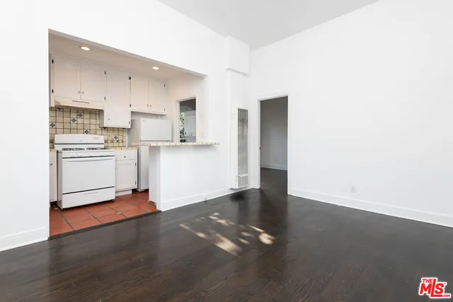 a view of a kitchen with wooden floor