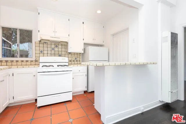 a bathroom with a bathtub and sink