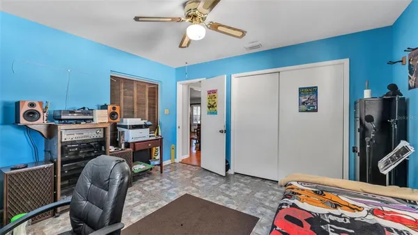 a bedroom with furniture and a flat screen tv