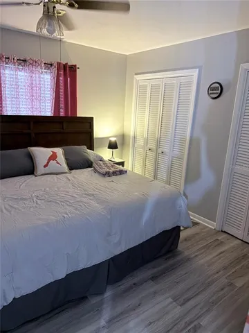 a bed room with a bed and a television