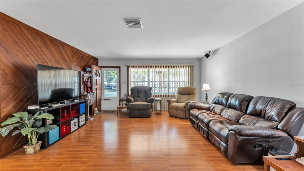 115 Morrow Circle Brandon, FL 33510 - Photo 24 of 48 a living room with furniture and a flat screen tv