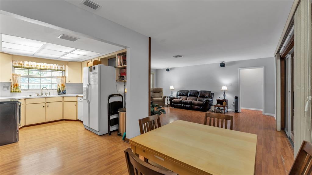 115 Morrow Circle Brandon, FL 33510 - Photo 27 of 48 a large kitchen with a table chairs refrigerator and stove