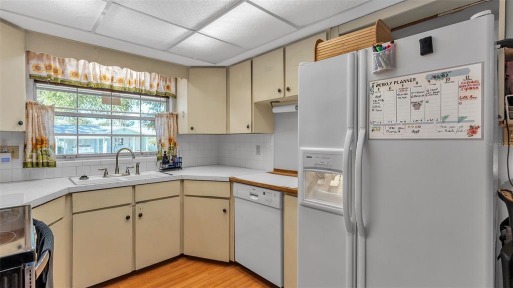 115 Morrow Circle Brandon, FL 33510 - Photo 30 of 48 a kitchen with stainless steel appliances a refrigerator sink and cabinets